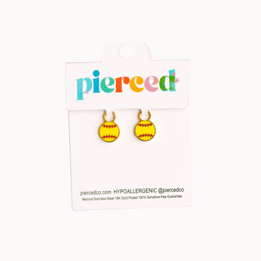 A pair of yellow softball stud earrings with red stitching details, displayed on a white 'pierced' brand card against a light off-white background.