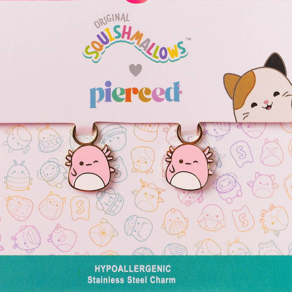 Squishmallows earrings on a branded packaging with a pink background