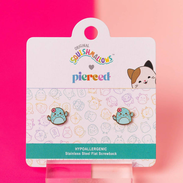 Squishmallows earrings on a branded card with a pink background