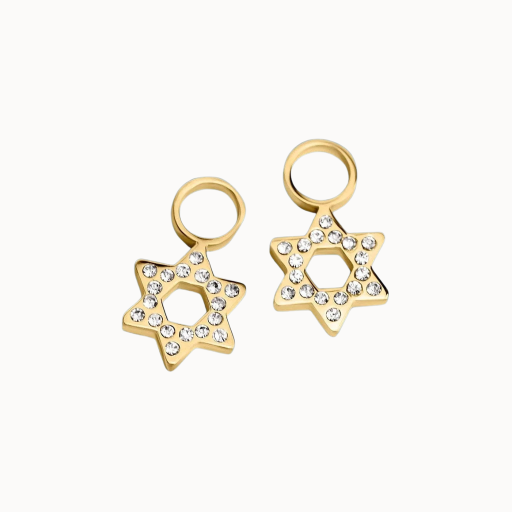 A pair of gold Star of David earrings embellished with clear rhinestones, shown on a clean off-white background.