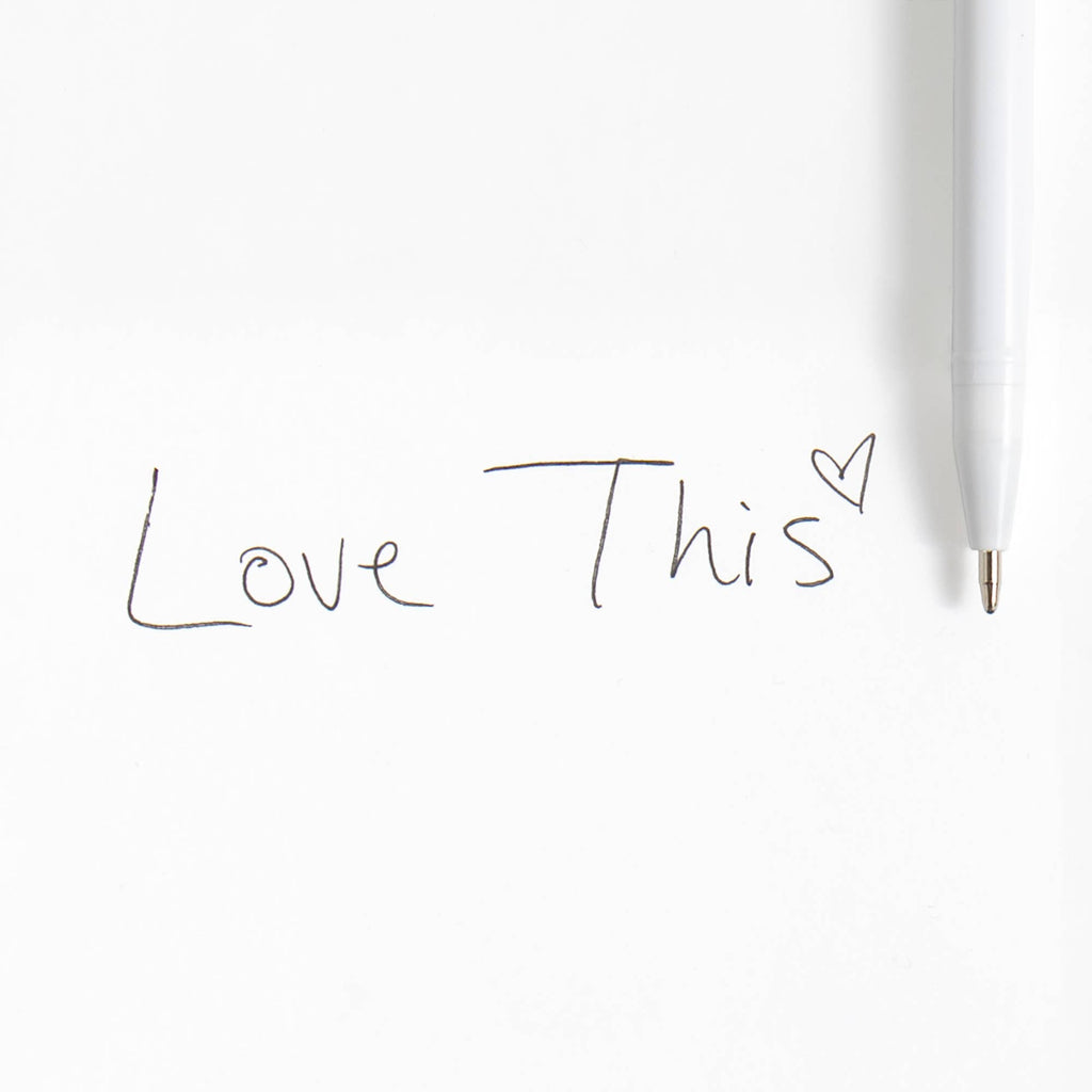 White pen with 'Love This' text on a white background