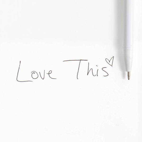 White pen with 'Love This' text on a white background