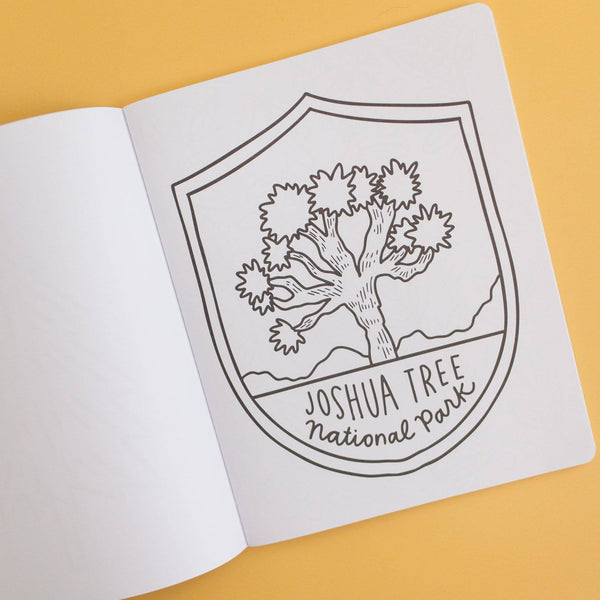 Joshua Tree National Park emblem on a white sheet of paper with a yellow background