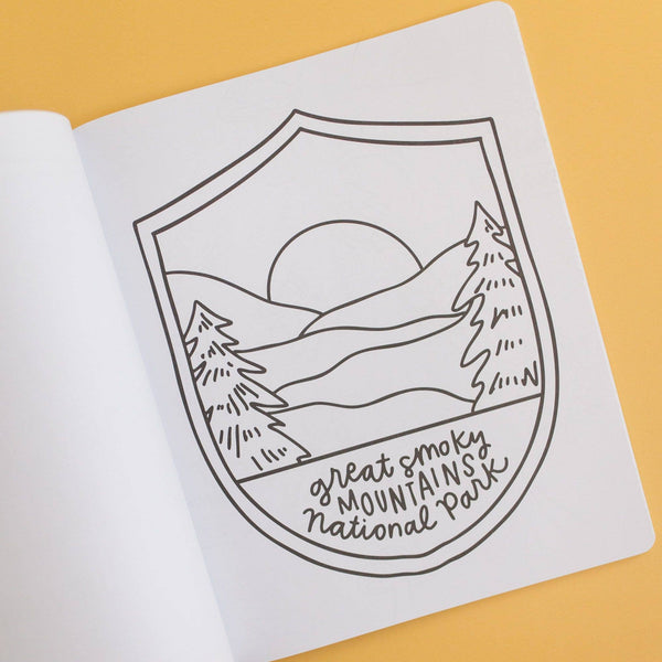 Outline drawing of a mountain landscape with 'Great Smoky Mountains National Park' text on a white sheet.