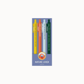 A set of four vertical pens in yellow, orange, light blue, and dark green, printed with inspirational nature-themed quotes. They are displayed on a lavender card with a circular logo that reads 'NATURE LOVER' and a small website URL underneath.