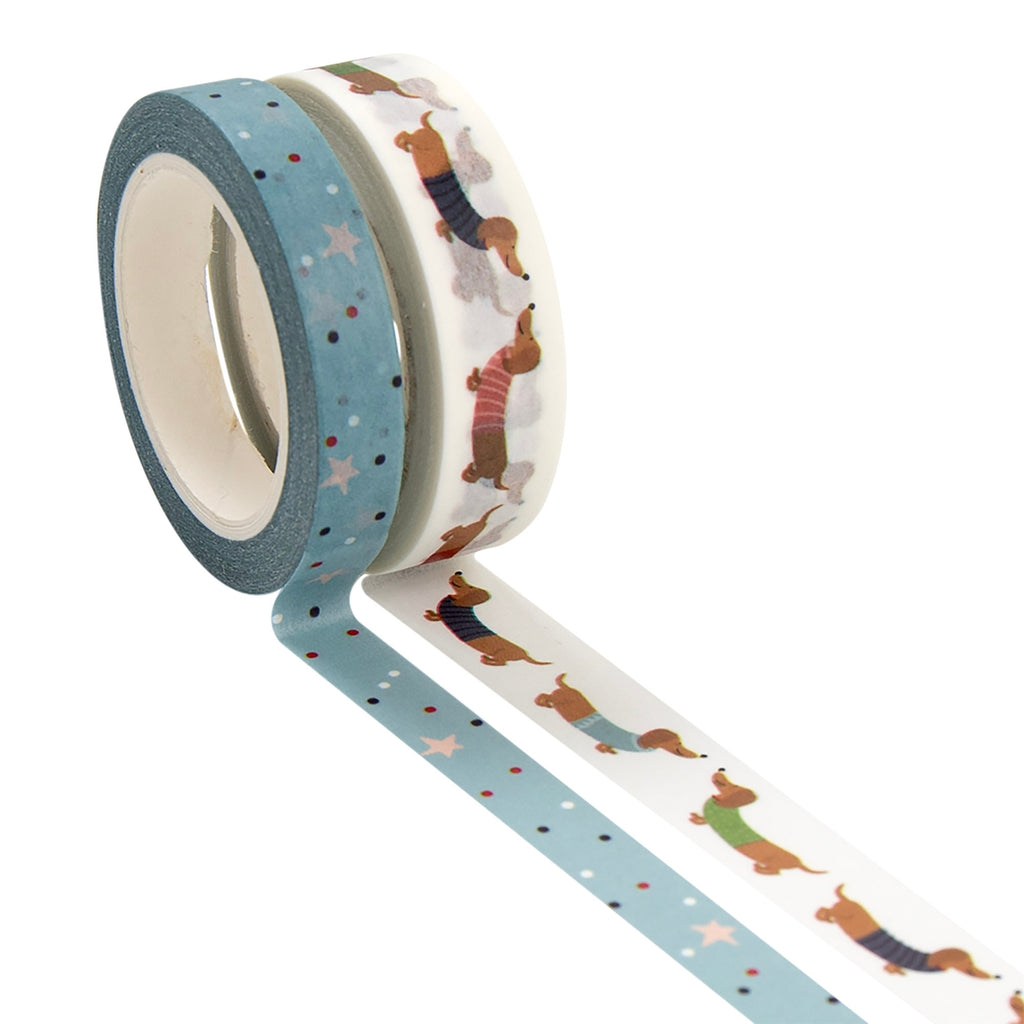 Two rolls of decorative tape with dog patterns on a white background