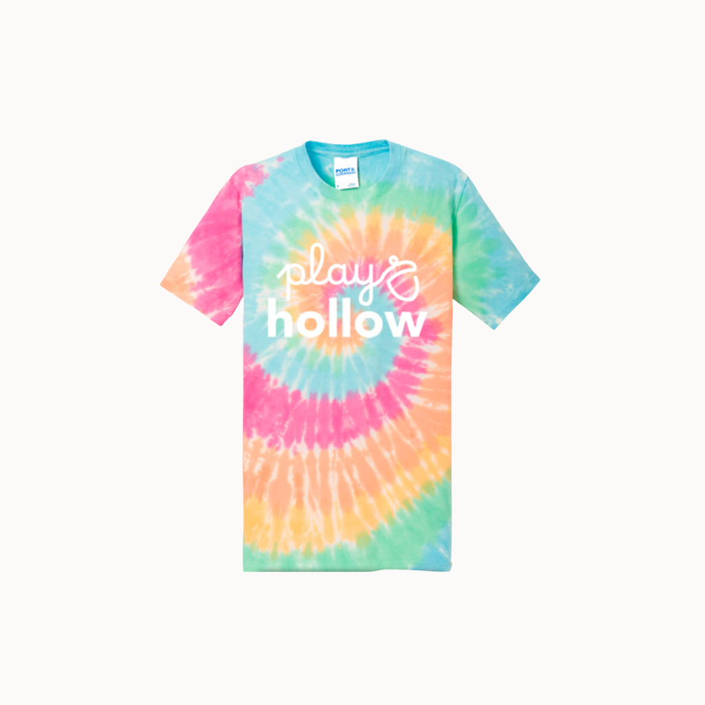 A short-sleeve crewneck tie-dye t-shirt featuring a spiral pattern of pink, yellow, green, and blue, with the words 'play & hollow' printed in white script across the chest. The Gildan brand tag is visible inside the collar.