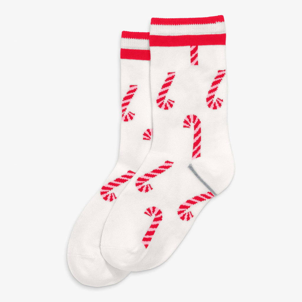 A pair of white crew socks with red candy cane patterns and red stripes at the top, displayed on a light gray background.