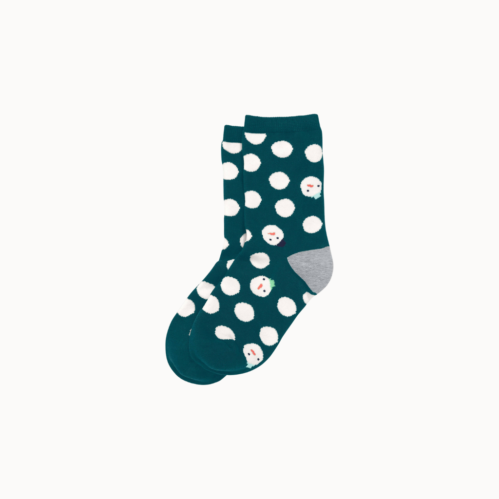 A pair of dark teal crew socks with white polka dots and small snowman faces, featuring a light gray heel and toe cap, shown on a light gray background.