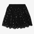 A black tulle tutu skirt with an all-over silver star and crescent moon pattern, featuring an elastic waistband, shown against a plain light gray background.