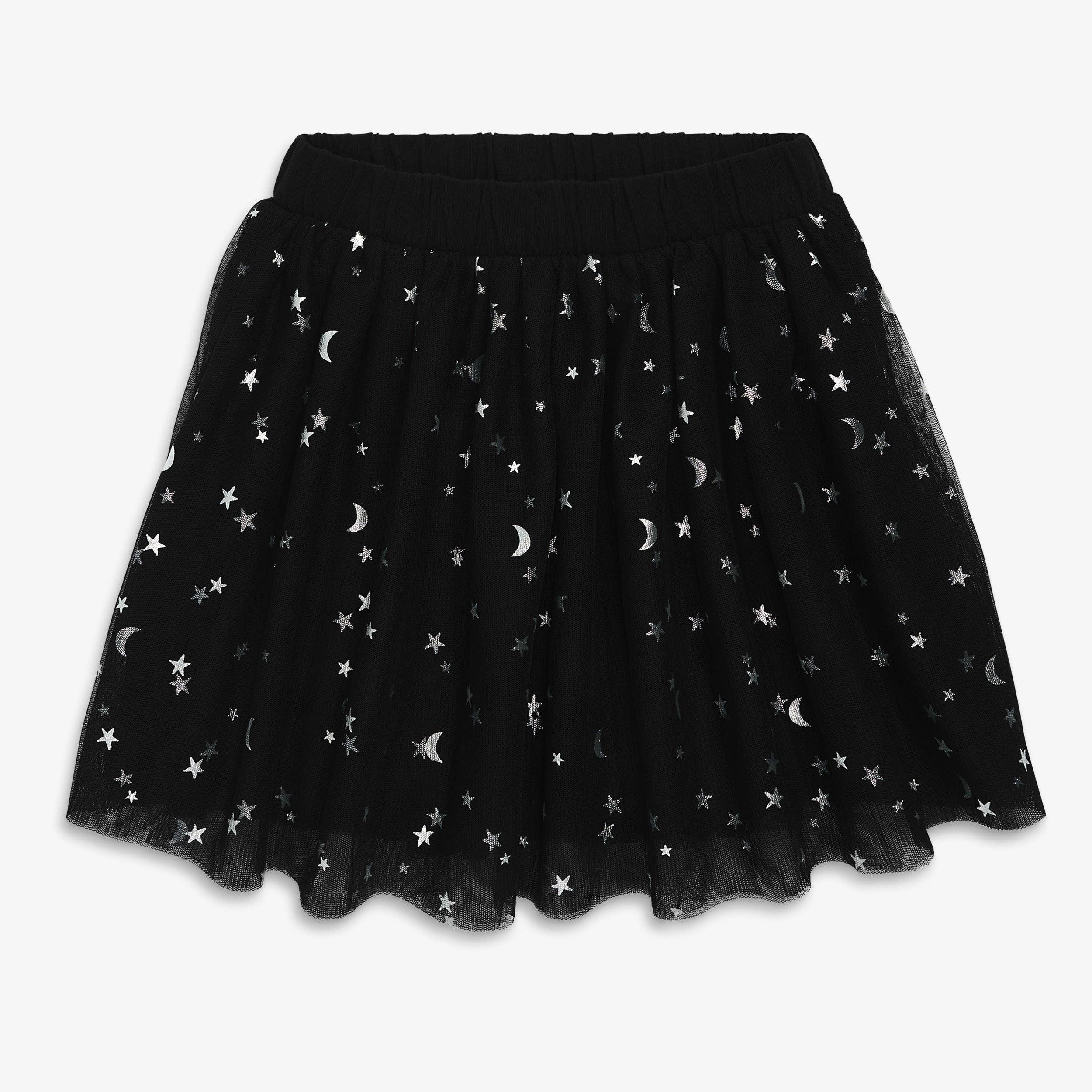 A black tulle tutu skirt with an all-over silver star and crescent moon pattern, featuring an elastic waistband, shown against a plain light gray background.