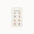 A set of eight small stud earrings displayed on a white card labeled 'Rockahula'. The earrings include moon phases, unicorns, and hearts in pastel colors like pink, yellow, and silver.
