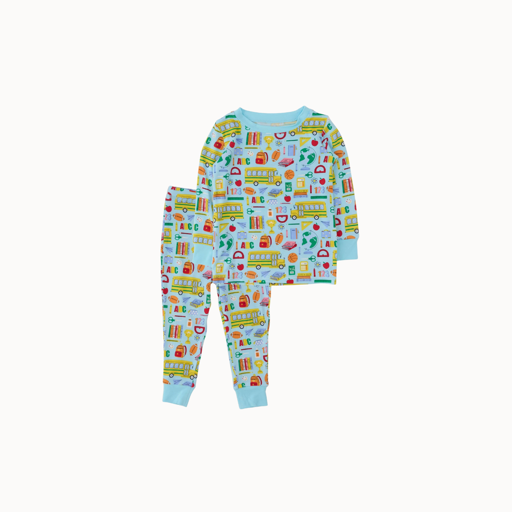 A two-piece children's pajama set featuring a long-sleeve top and matching pants with a colorful school-themed print of buses, books, and pencils on a light blue background.
