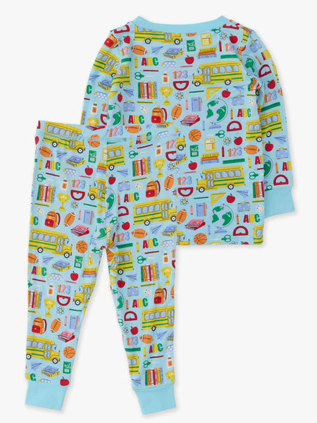 Children's pajama set with school-themed design on a light blue background