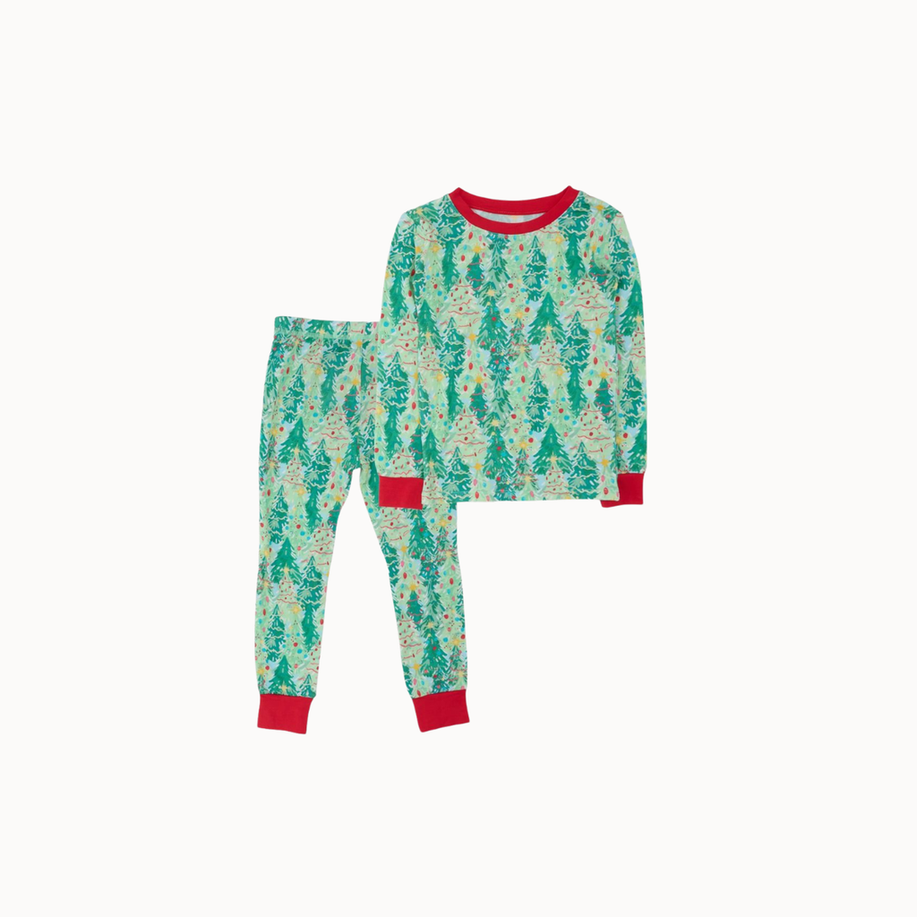 A two-piece children's pajama set featuring a long-sleeve top and matching pants with a green Christmas tree pattern on a cream background, accented with red ribbed collar, cuffs, and hem.
