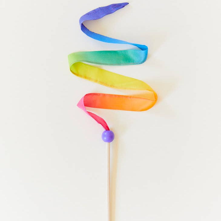 rainbow ribbon wand on a white background