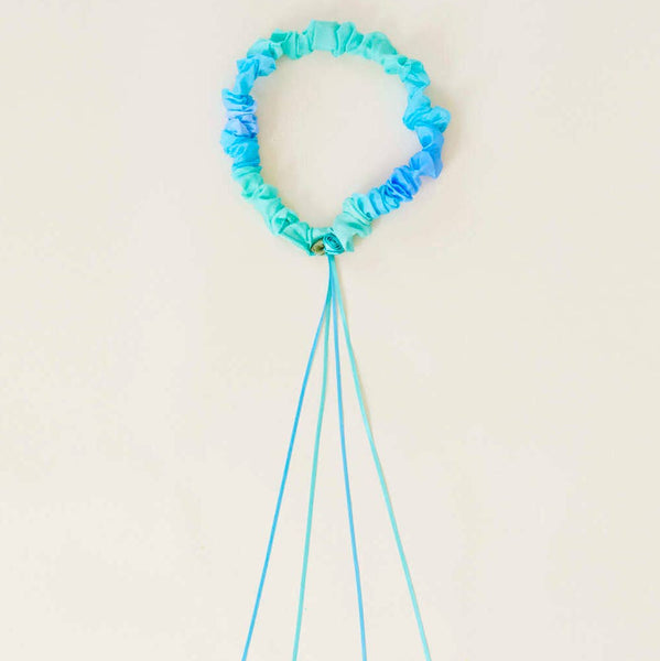Blue silk garland headband with ribbons on a white background