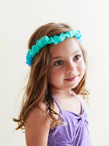 Blue silk headband on a girl's head