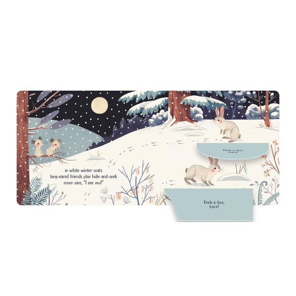 Children's book with winter scene and rabbit illustration on a white background