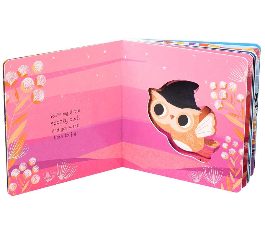Children's book open to a page with an owl illustration and text on a pink background