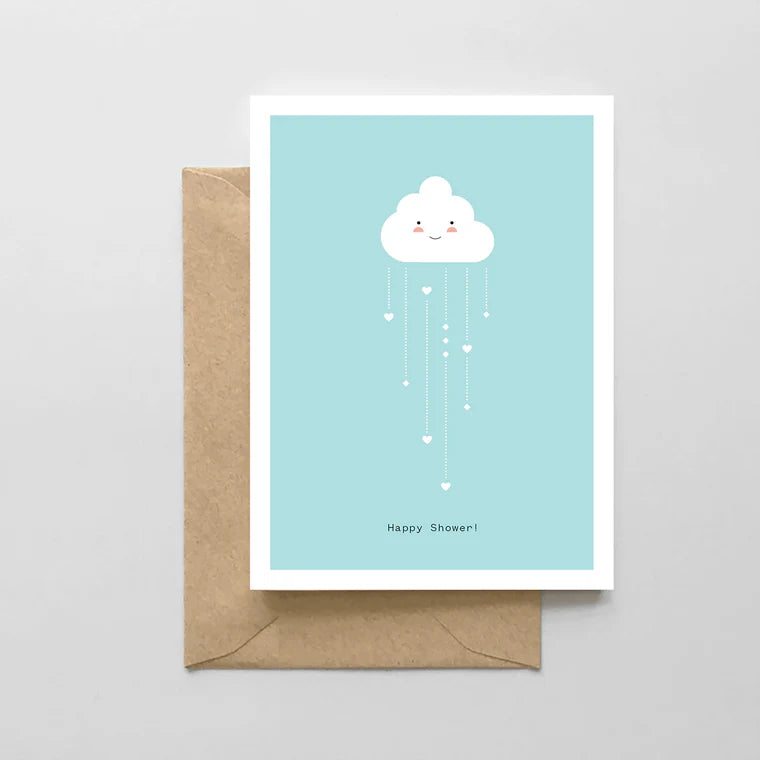 cloud raining hearts on light blue card on brown envelope