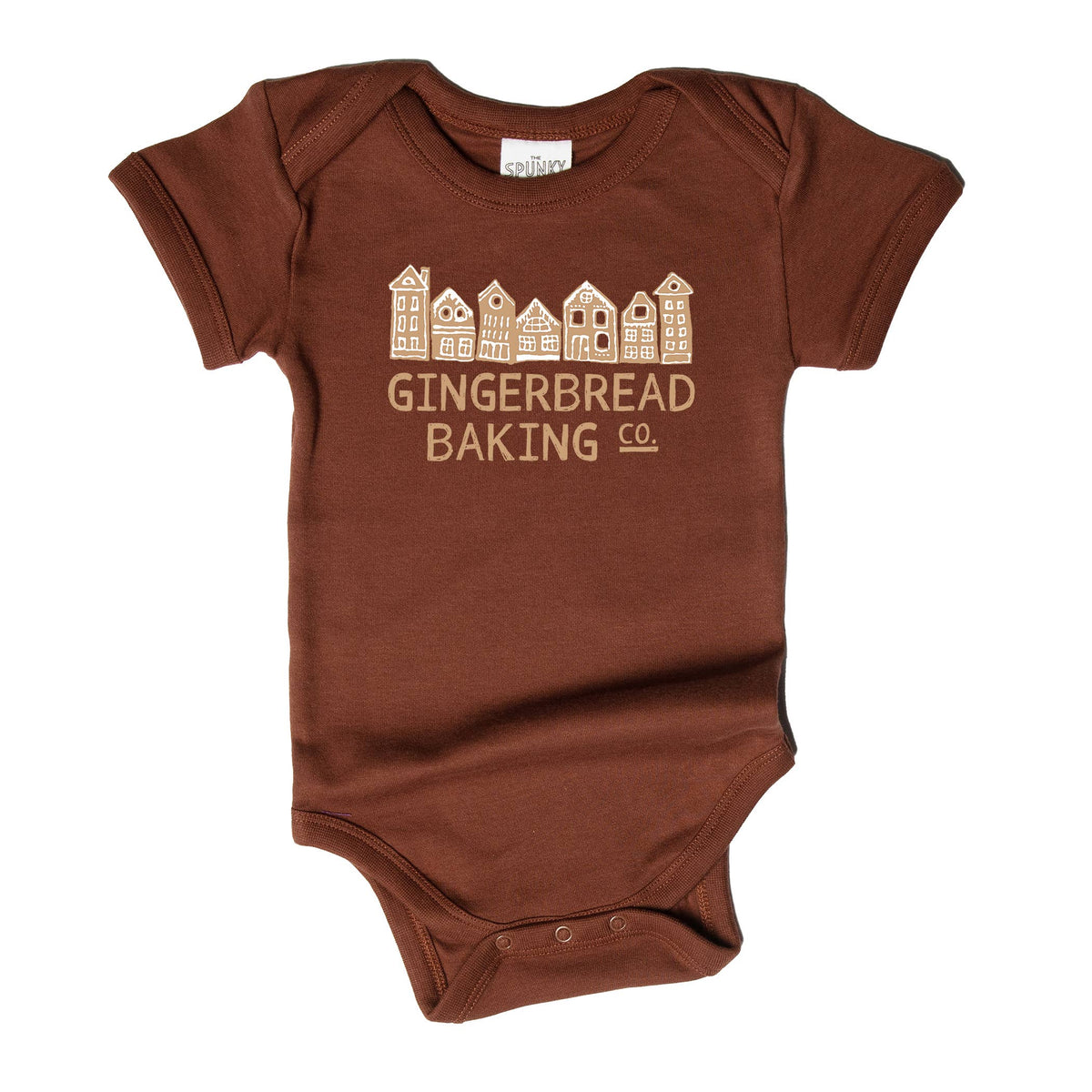 A brown short-sleeve baby bodysuit with a light beige graphic of gingerbread houses and the text 'GINGERBREAD BAKING CO.' printed on the chest, shown against a plain white background.