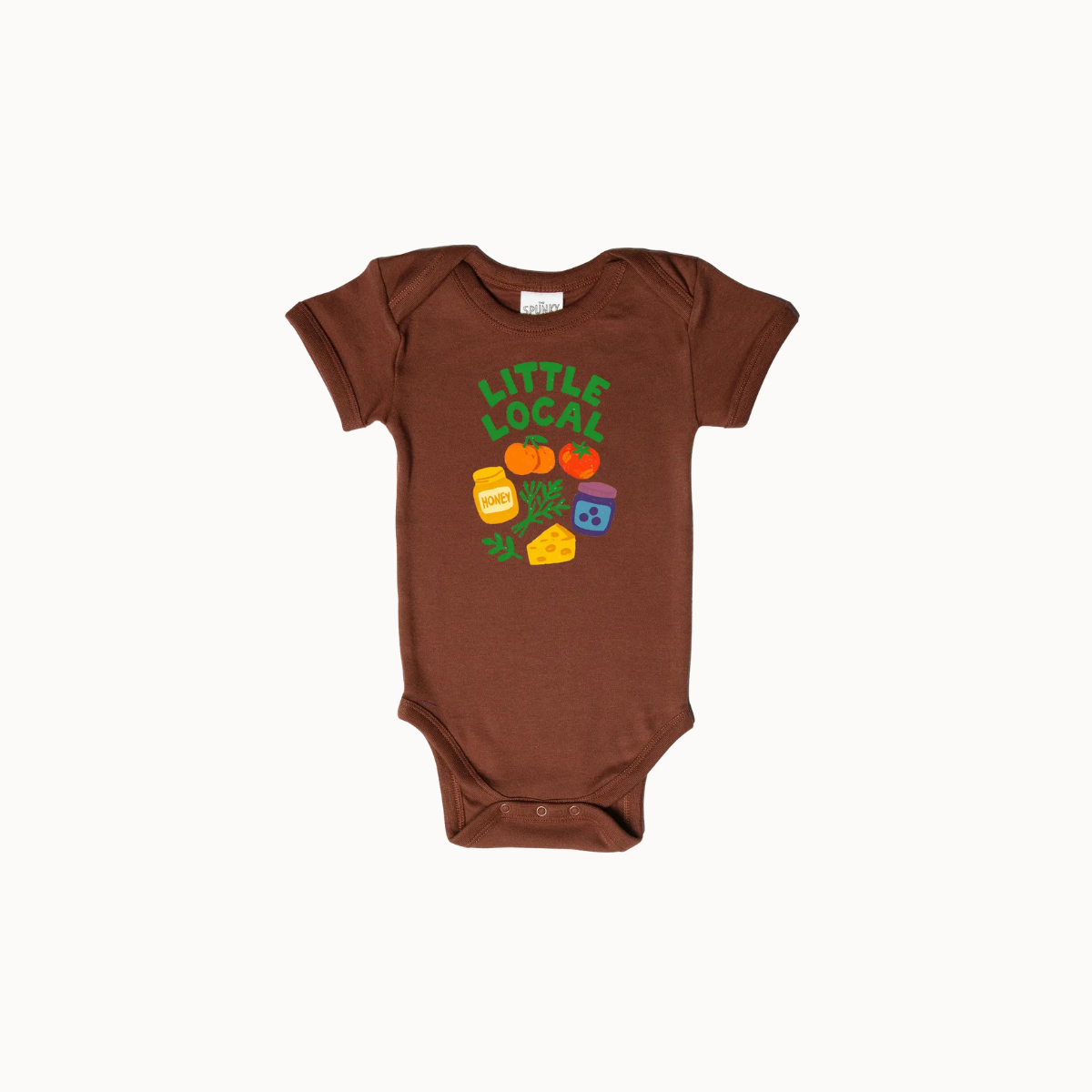 A brown short-sleeve baby bodysuit featuring a colorful graphic on the chest with the text 'LITTLE LOCAL!' and illustrations of jars, pumpkins, and a green leaf, displayed on a clean white background.
