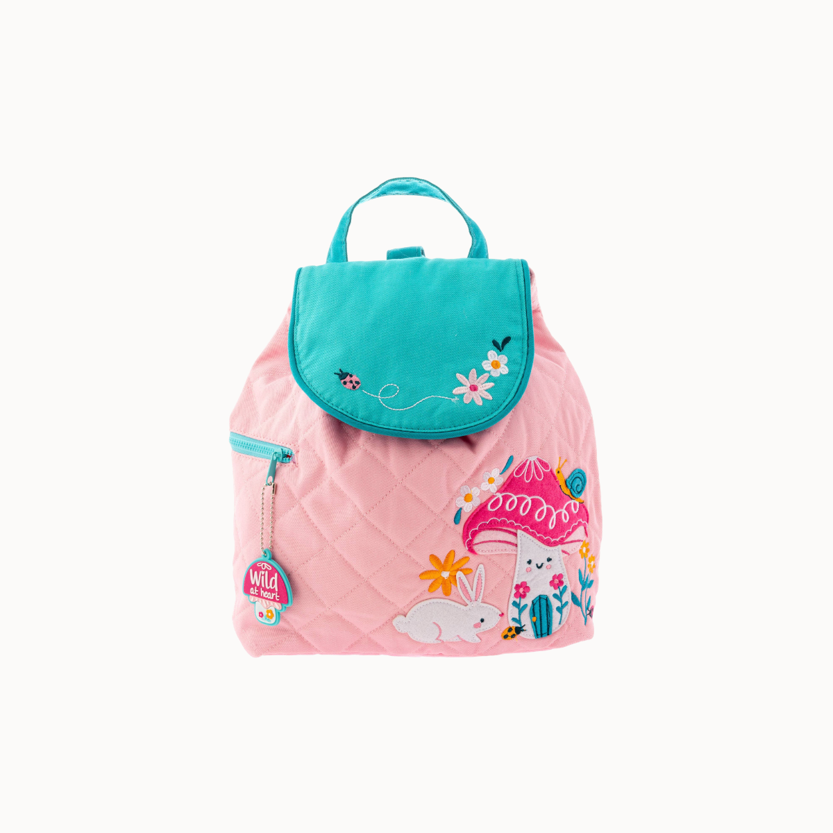 A pink quilted backpack with a turquoise flap and top handle, decorated with a whimsical mushroom house, rabbit, flowers, and a bee patch on the front.