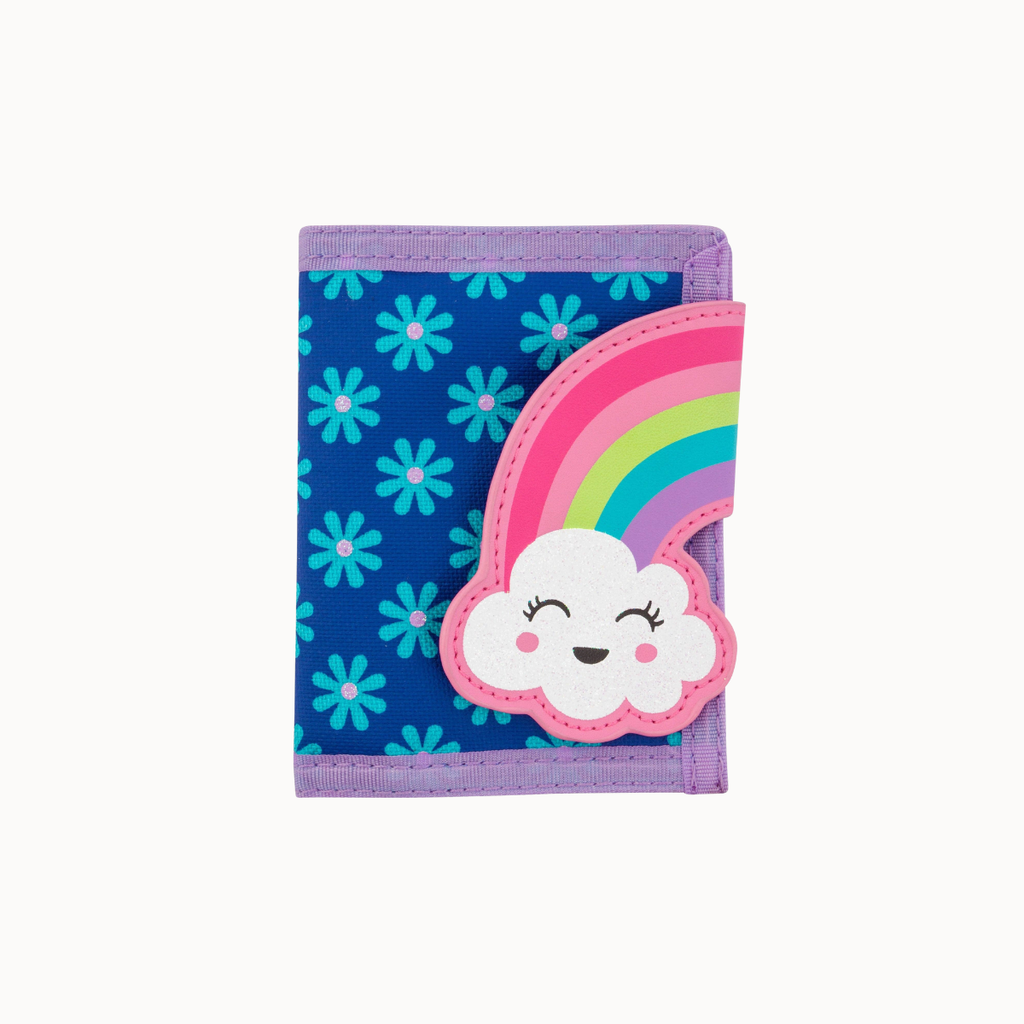 A small bi-fold wallet with a blue background patterned with light blue flowers, featuring a large applique of a smiling white cloud under a pastel rainbow on the front, and purple trim.