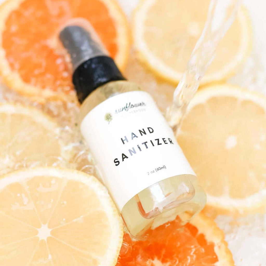hand sanitizer spray bottle on top of lemon slices