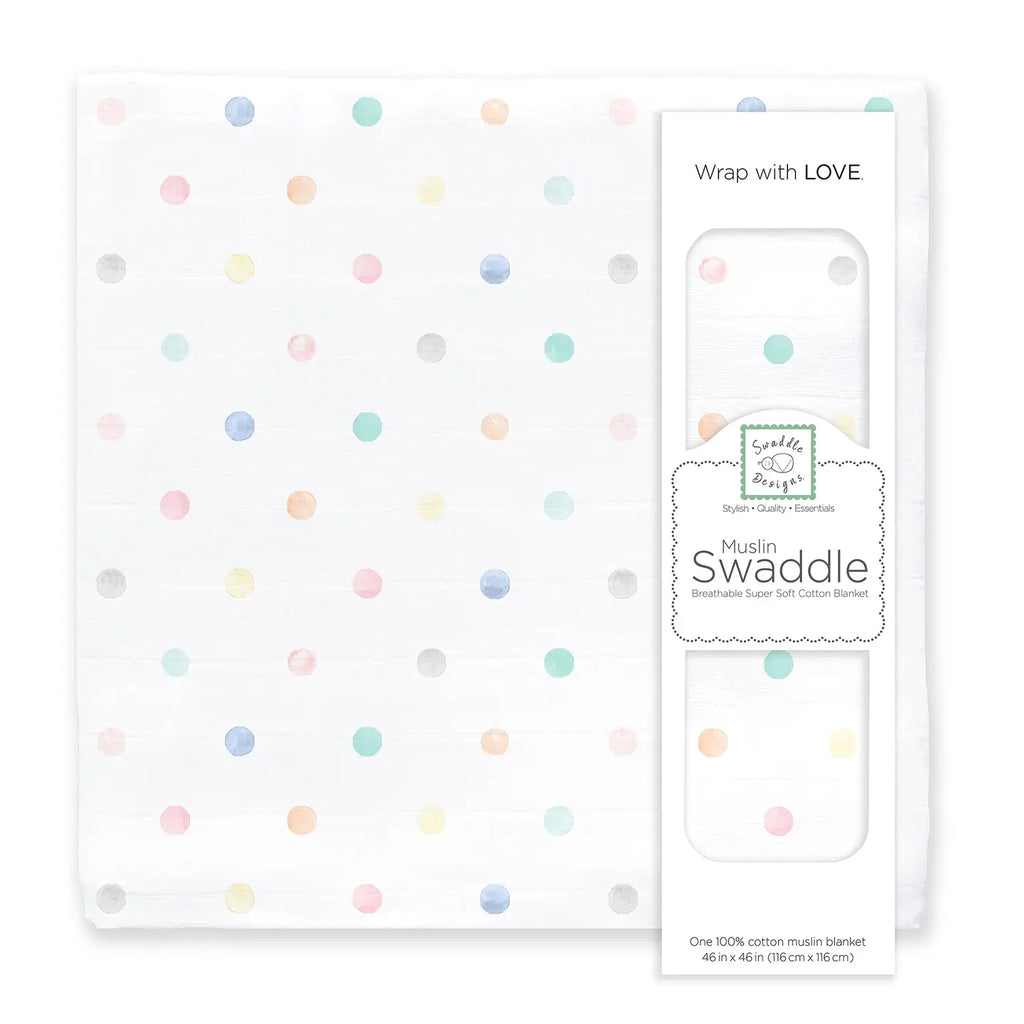 Cotton muslin swaddle blanket with colorful polka dots and packaging on a white background
