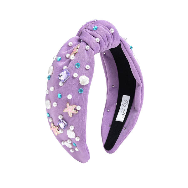 Lavender headband with decorative elements on a white background