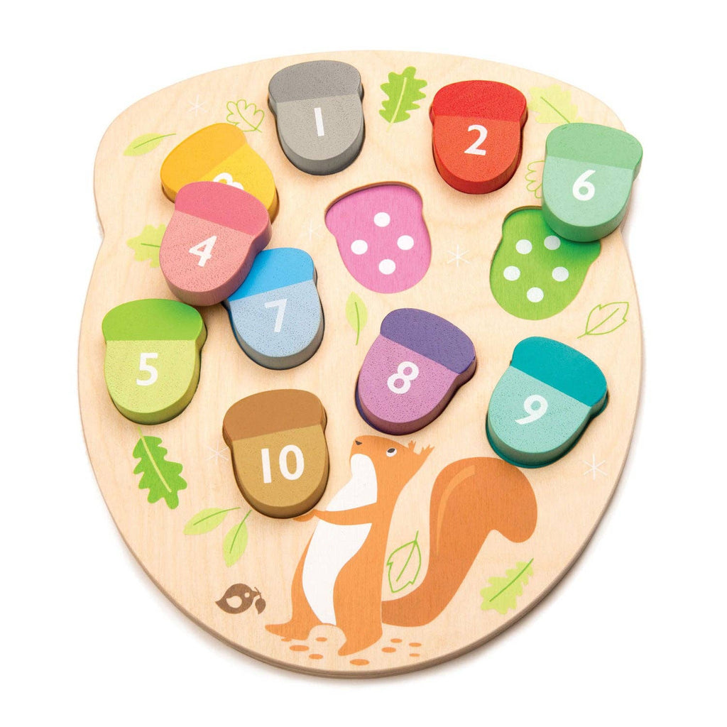 A wooden number and shape matching puzzle board for toddlers, featuring a natural wood base with a printed squirrel and leaf motifs, and ten colorful acorn-shaped pieces numbered 1 to 10.