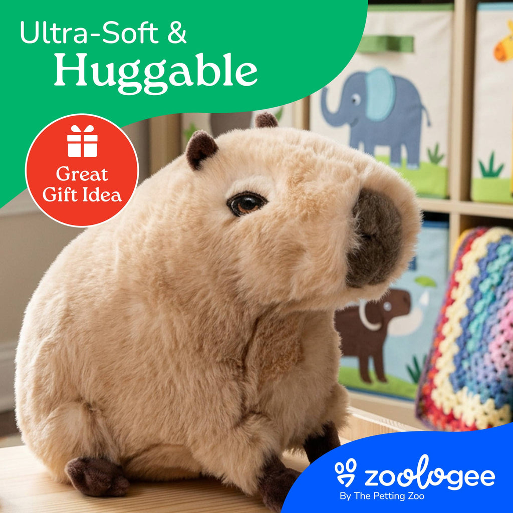A plush capybara toy in light beige faux fur with dark brown ears, eyes, and feet, sitting on a wooden surface. The background shows a colorful children's room with animal-themed storage bins and a crocheted blanket.