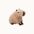 A plush capybara toy with light beige fur, dark brown paws and ears, and a dark brown snout, shown against a plain white background.