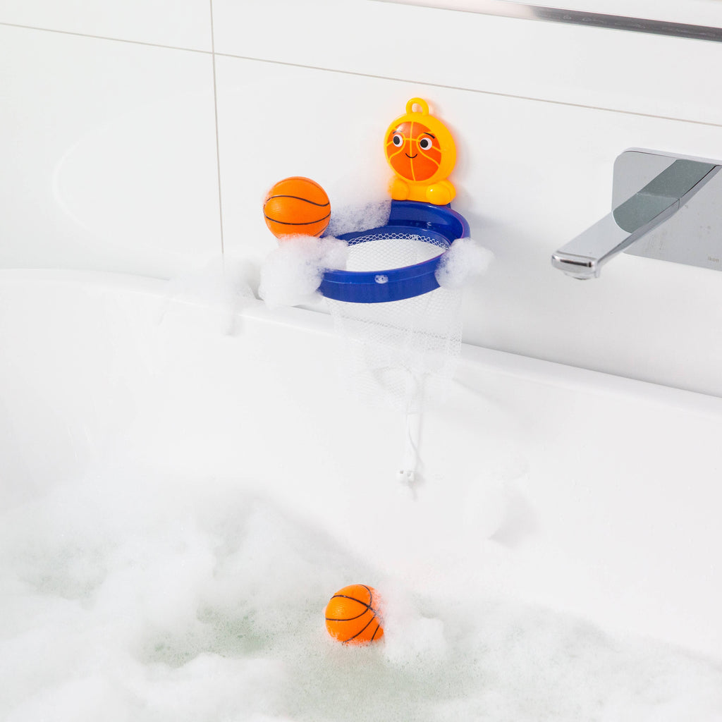 Bath toy with basketball hoop and balls in a bathtub filled with bubbles