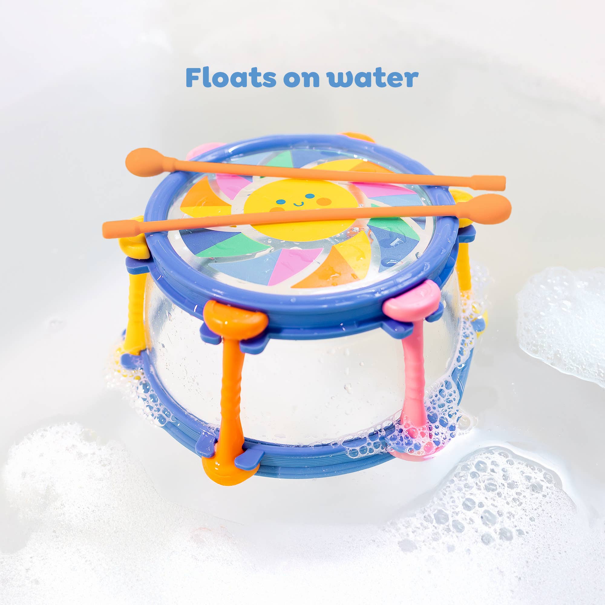 Colorful children's drum with drumsticks on a white background