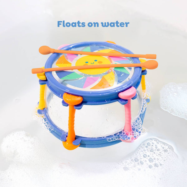 Colorful children's drum with drumsticks on a white background