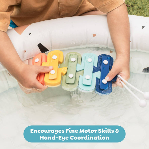 Child playing with colorful letter-shaped toys in water, with text 'Encourages Fine Motor Skills & Hand-Eye Coordination'.