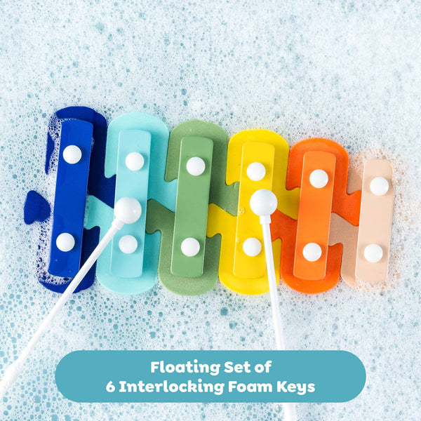 Colorful set of interlocking foam keys with white handles on a textured blue background.