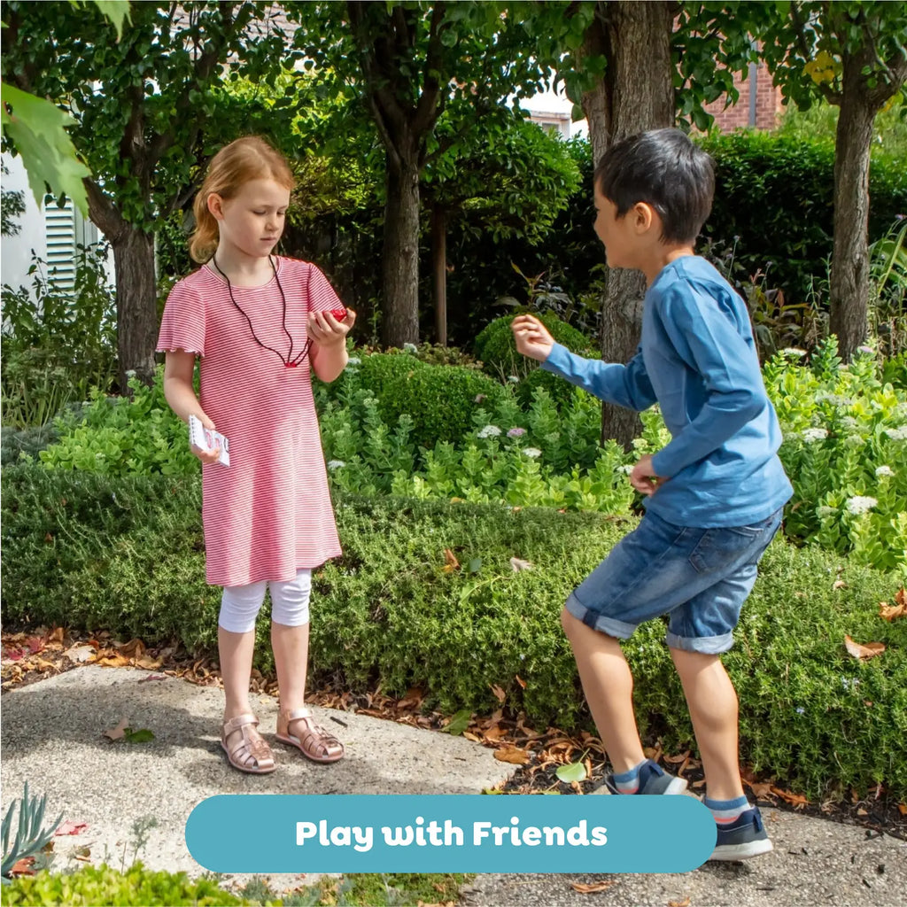 Two children playing outdoors with a garden background