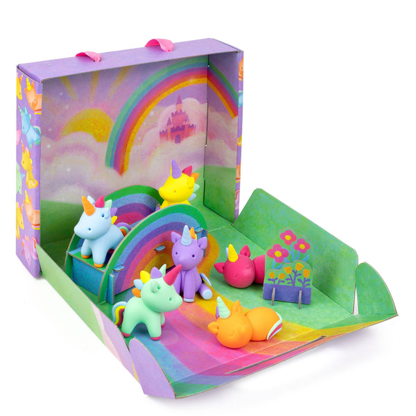 Colorful toy set with unicorns and rainbow in a box