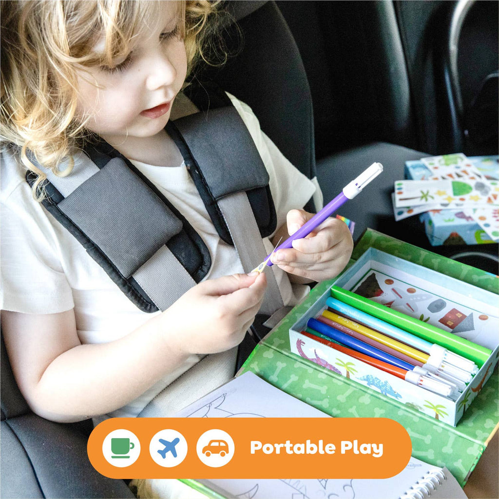 Child in a car seat with a portable play kit, including coloring books and markers.