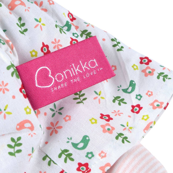 Fabric with colorful patterns and a pink 'Bonikka' label on a white background
