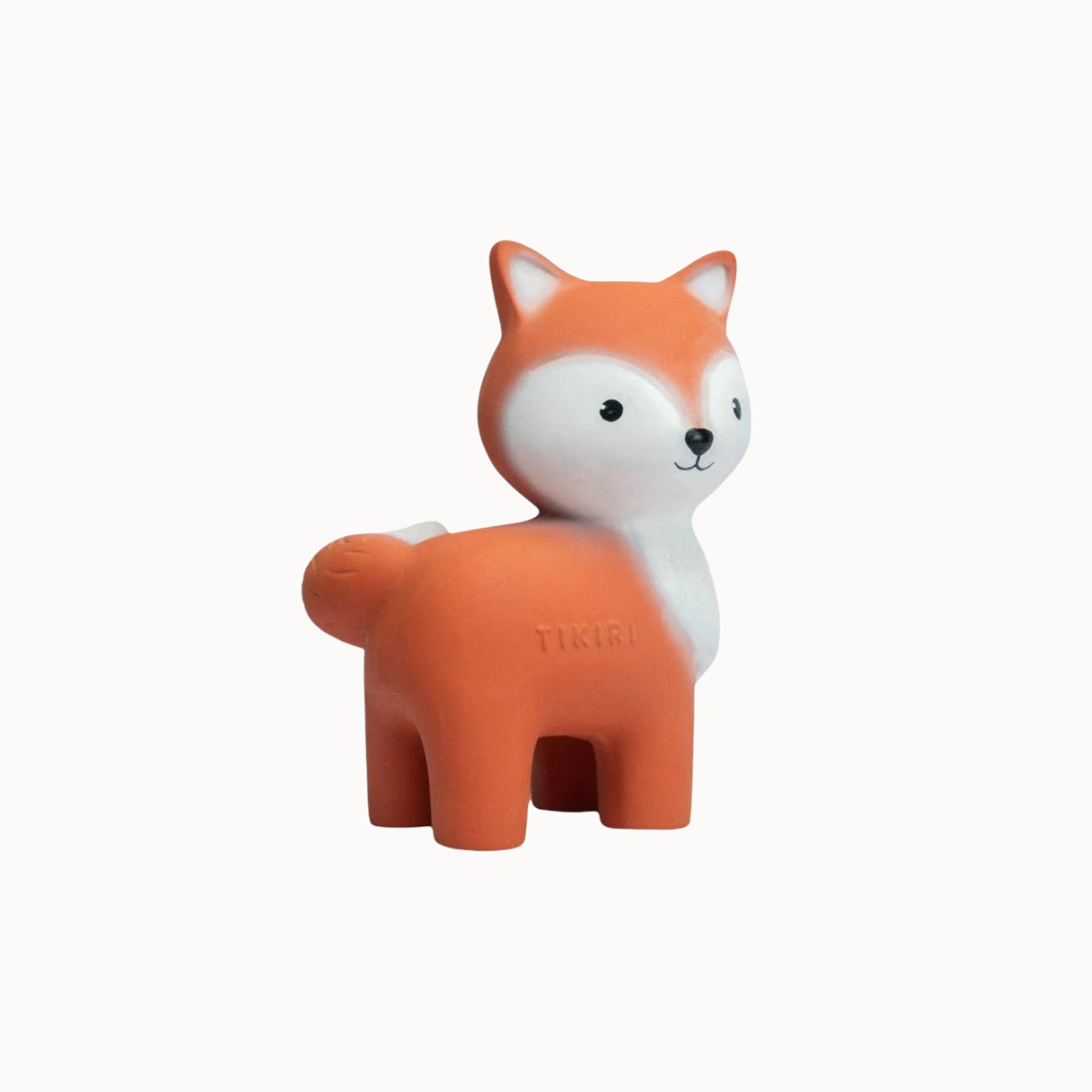 An orange and white rubber fox toy with a small embossed 'TIGER' logo on its side, shown against a plain off-white background.