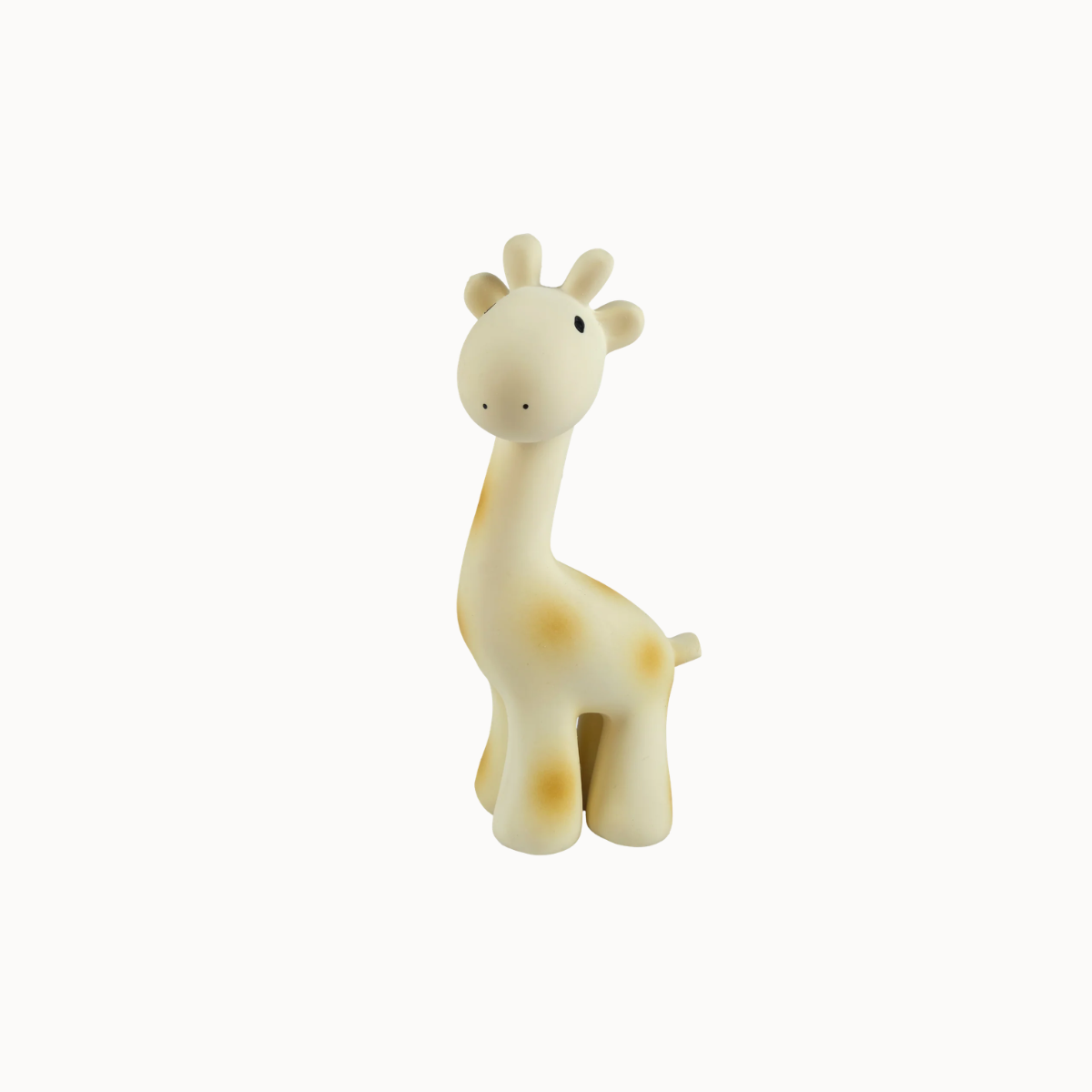 A small giraffe figurine or toy in a cream color with light brown spots, standing against a plain white background.