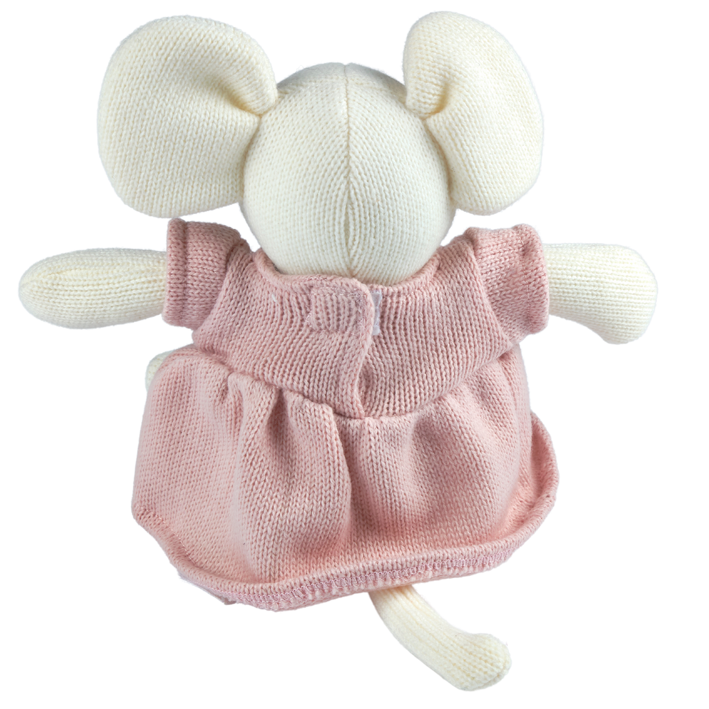 Knitted toy with a pink dress on a white background