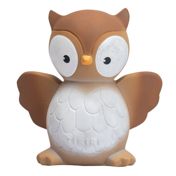 Owl-shaped night light with a white face and brown wings on a white background
