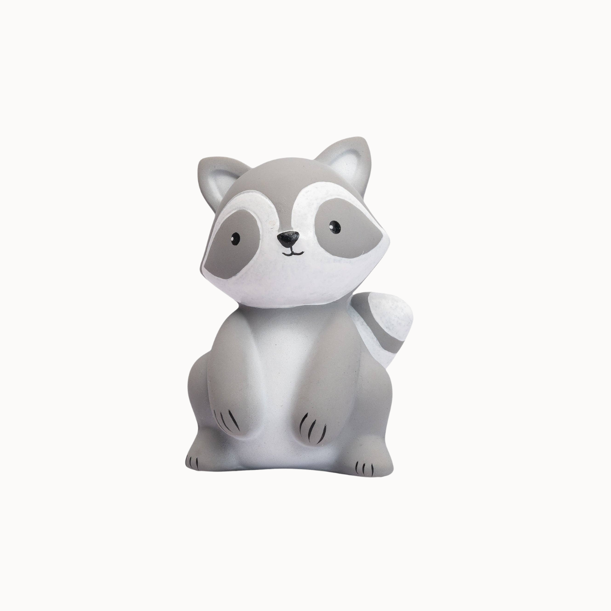 A small gray and white raccoon figurine or toy shown against a plain light gray background.