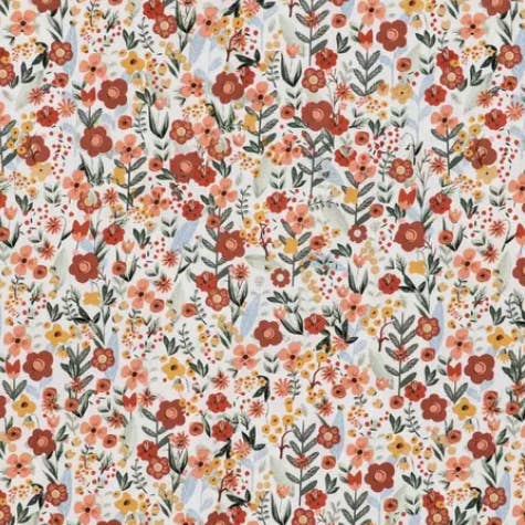 A close-up of a repeating floral pattern with small orange, red, peach, yellow, and green flowers and leaves on a light off-white background.